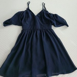 Cold shoulder with ruffles, navy blue, never worn